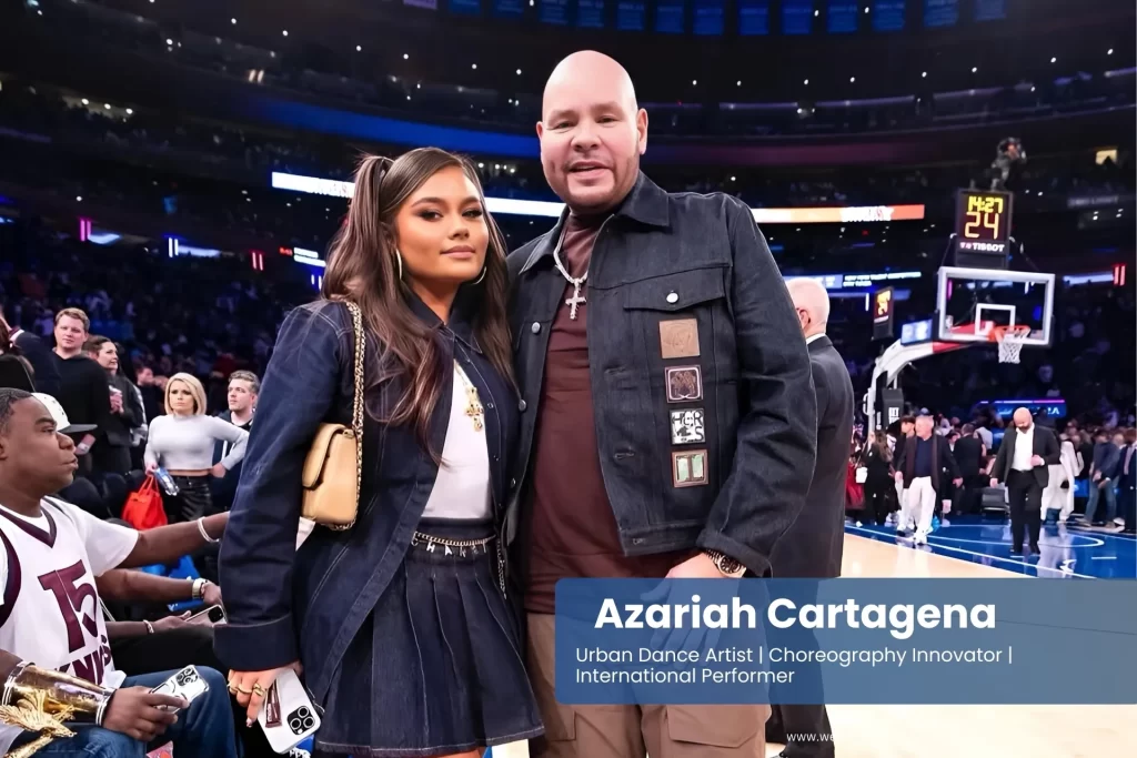 Azariah Cartagena and father Fat Joe share a moment at a basketball game, celebrating family bonds and hip-hop legacy