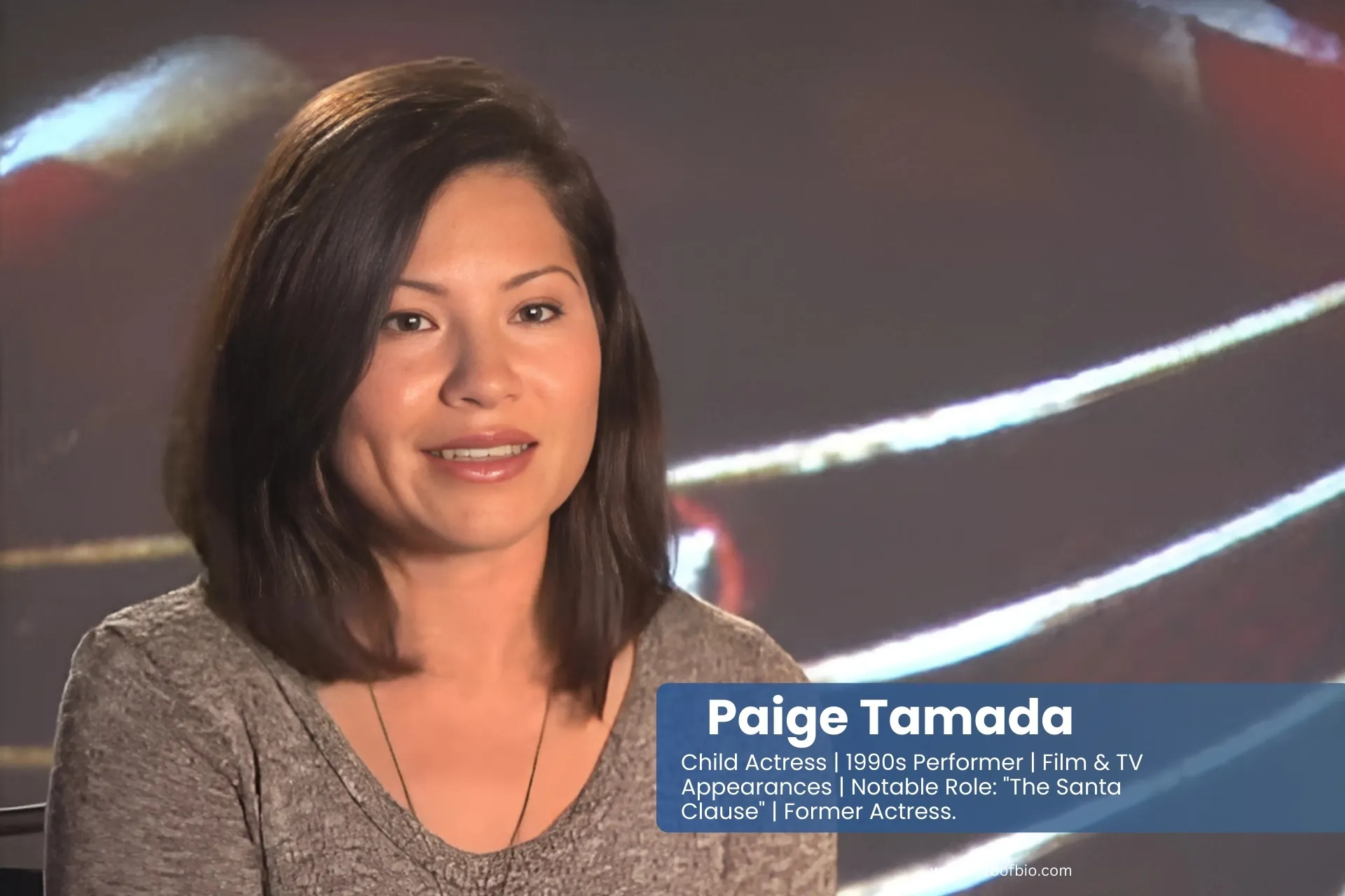 Paige Tamada engages on-camera in a gray shirt, reflecting media-savvy charisma and modern communication skills