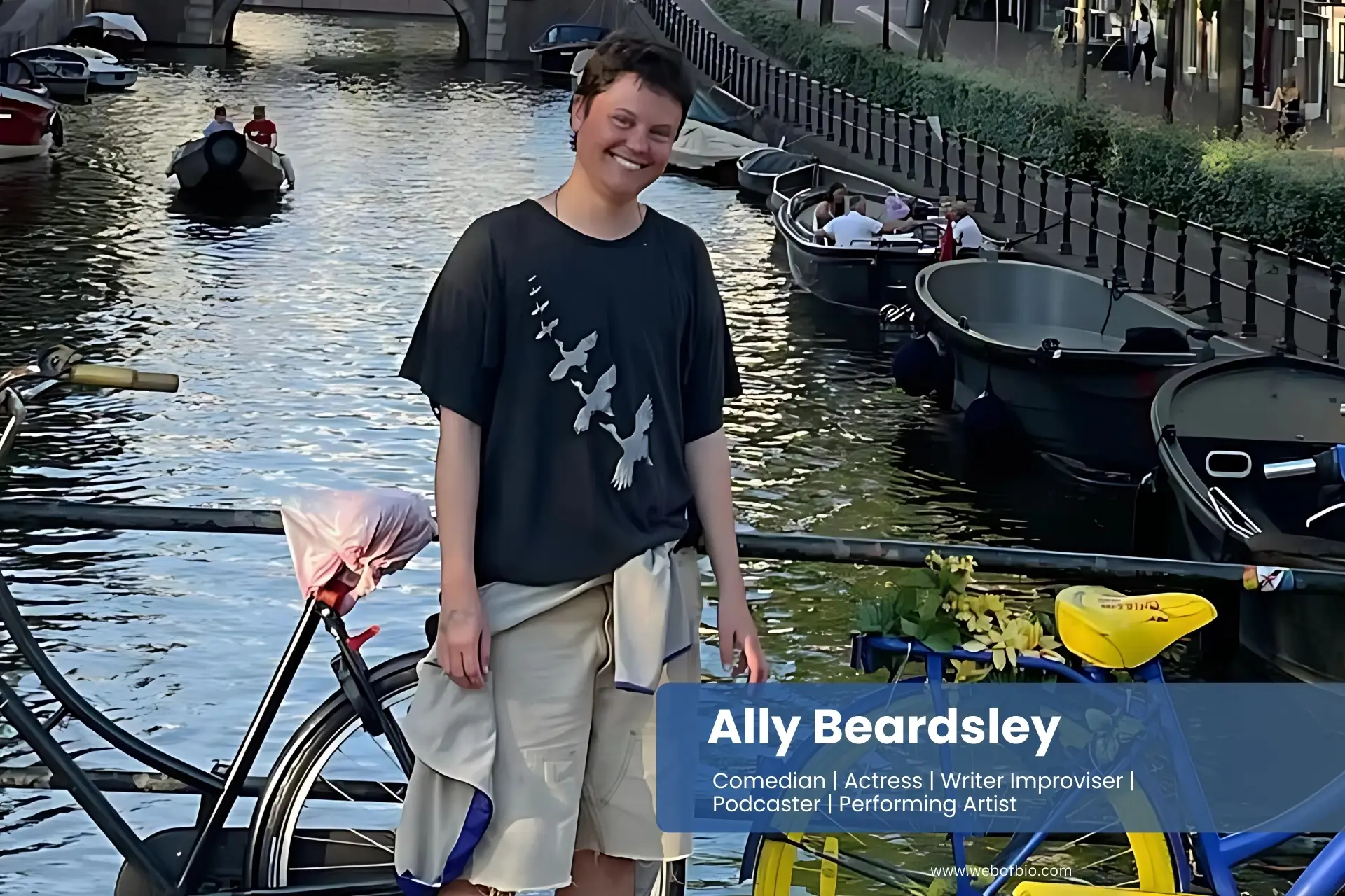 Ally Beardsley standing next to a bike in front of a canal.