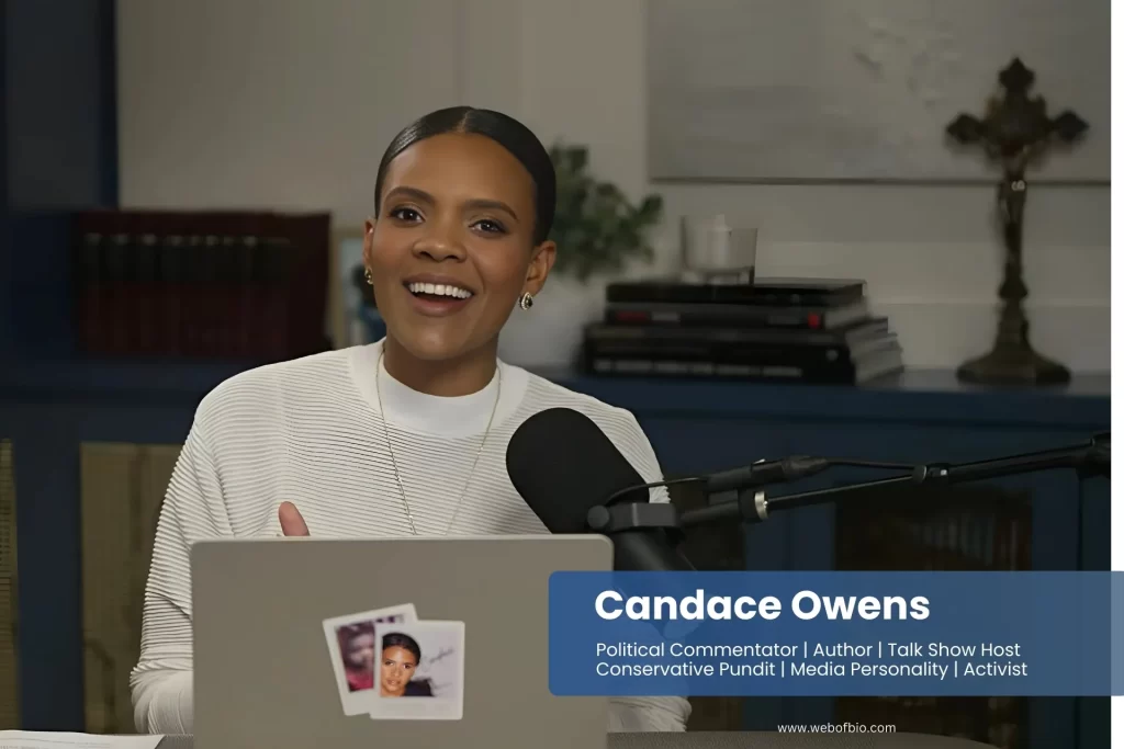 Candace Owens sitting in front of a laptop with a microphone.