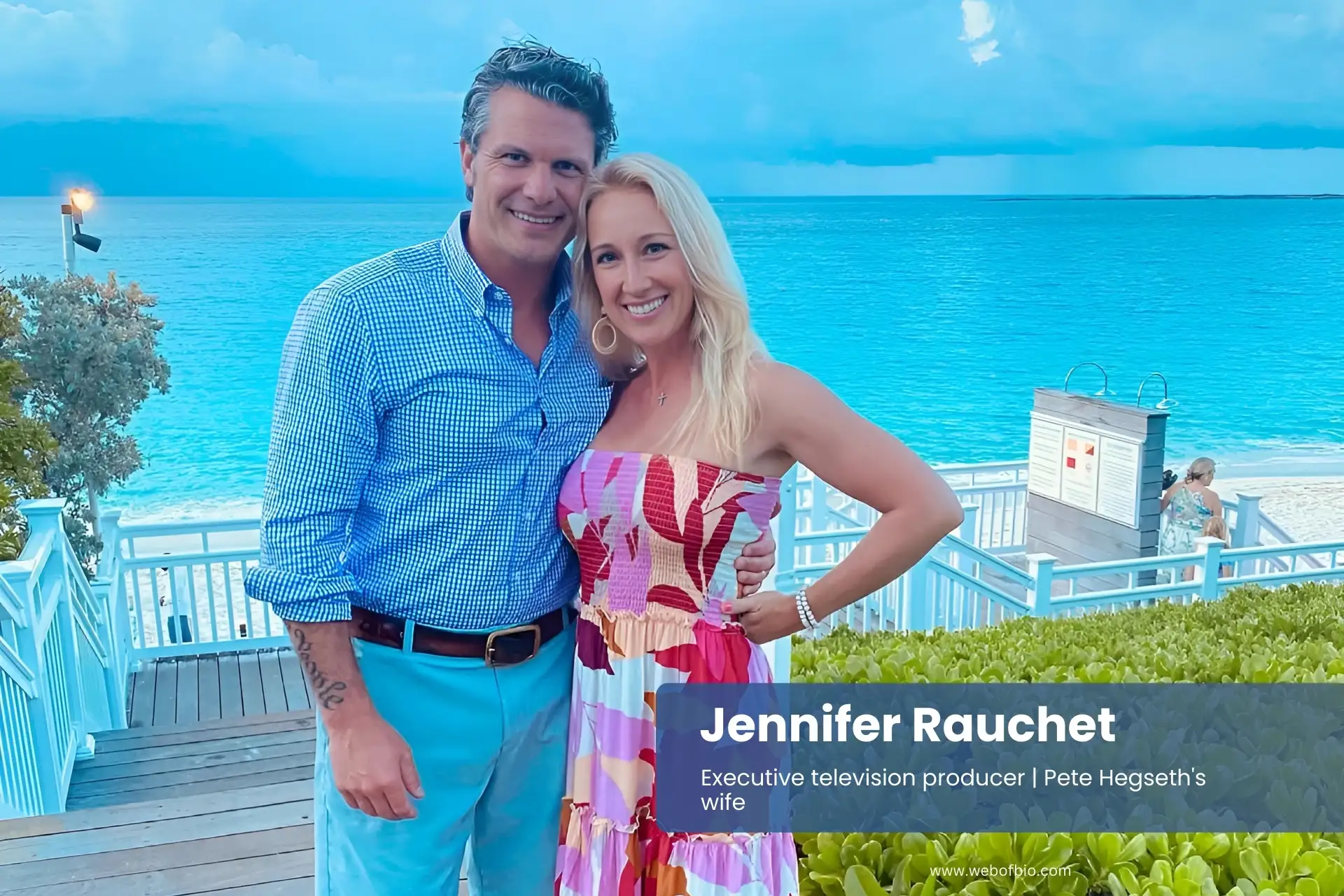Jennifer Rauchet posing with her husband Pete Hegseth for a photo on the beach.