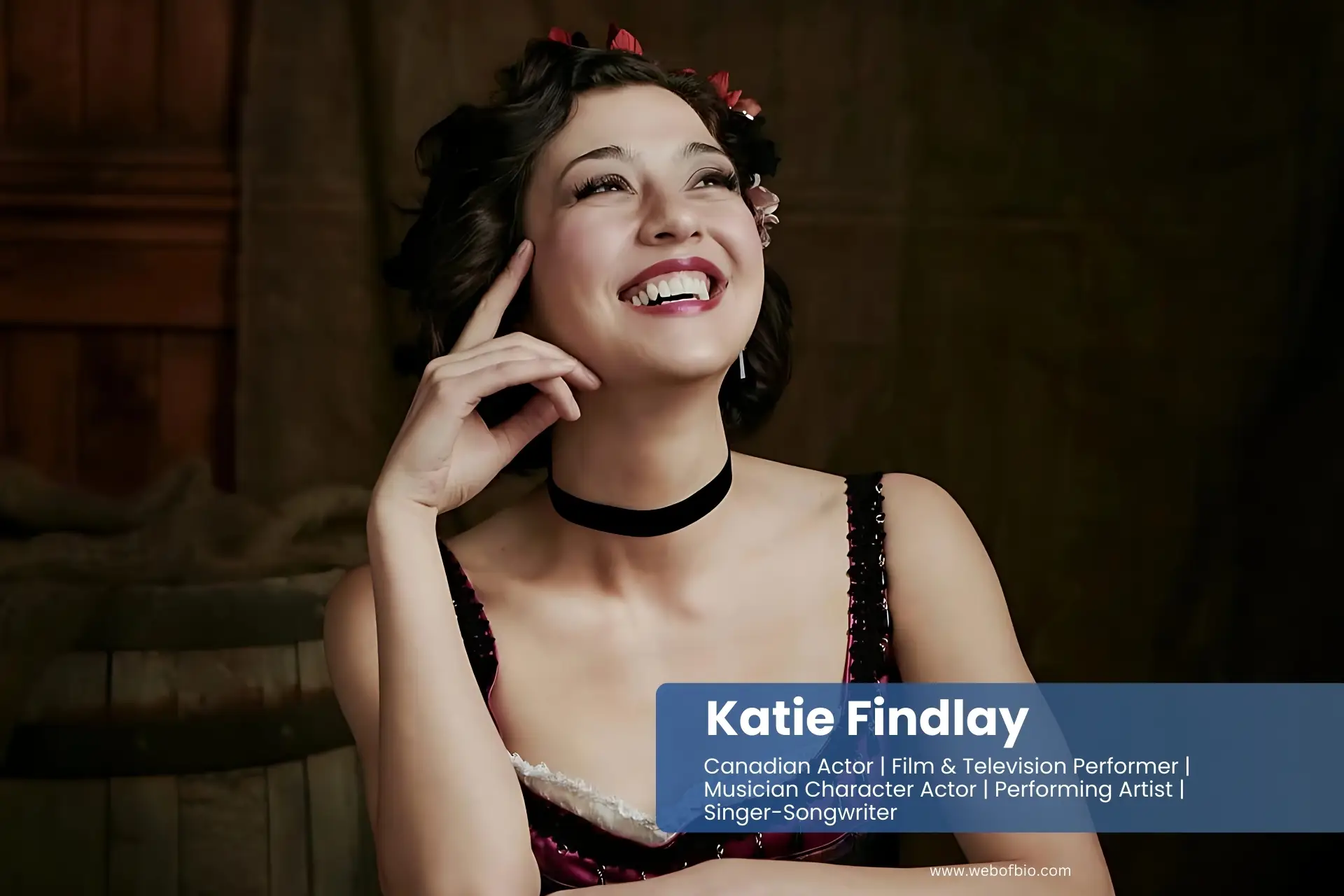 Katie Findlay in a pink dress smiling.