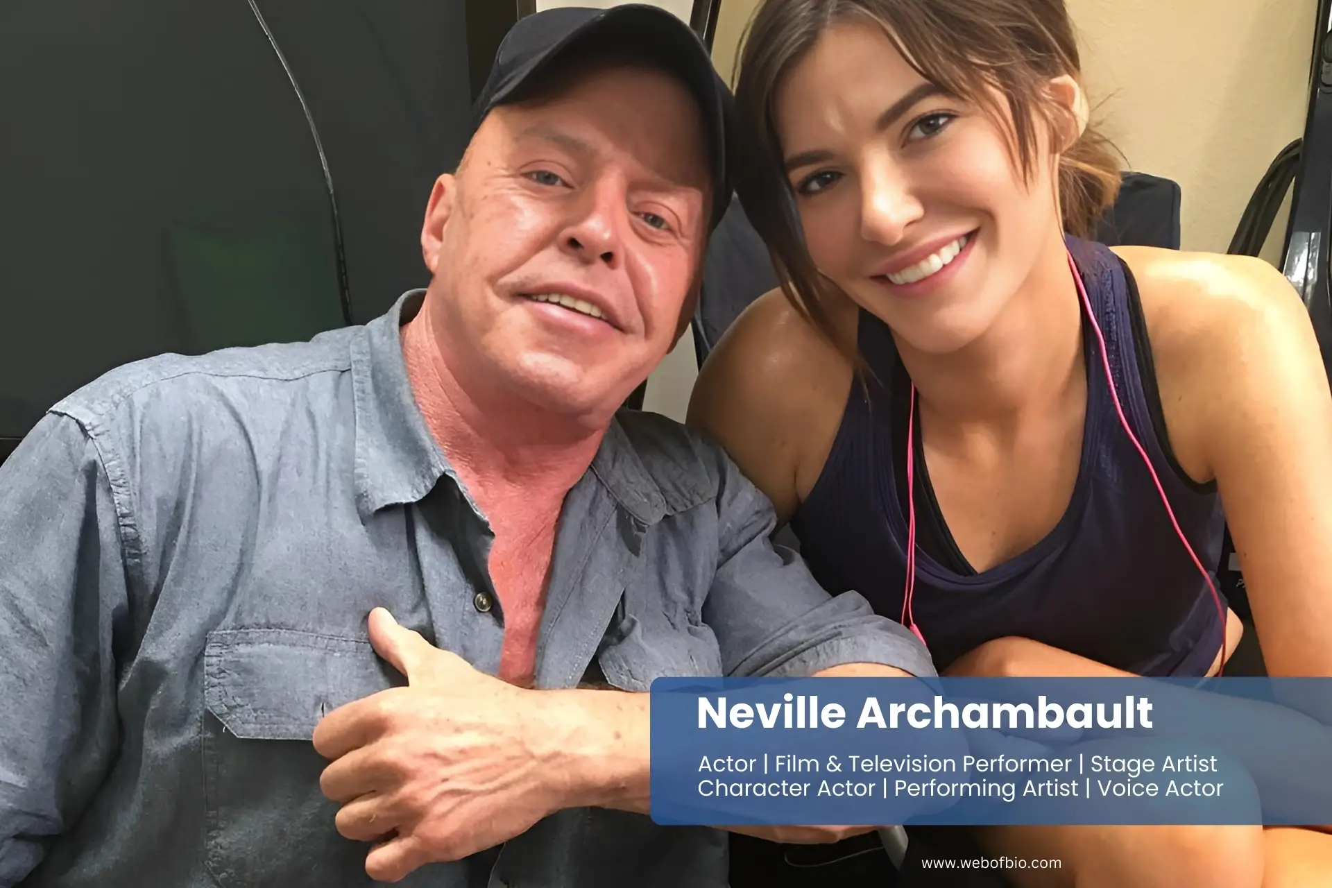 Neville Archambault sitting next to partner person in a gym.