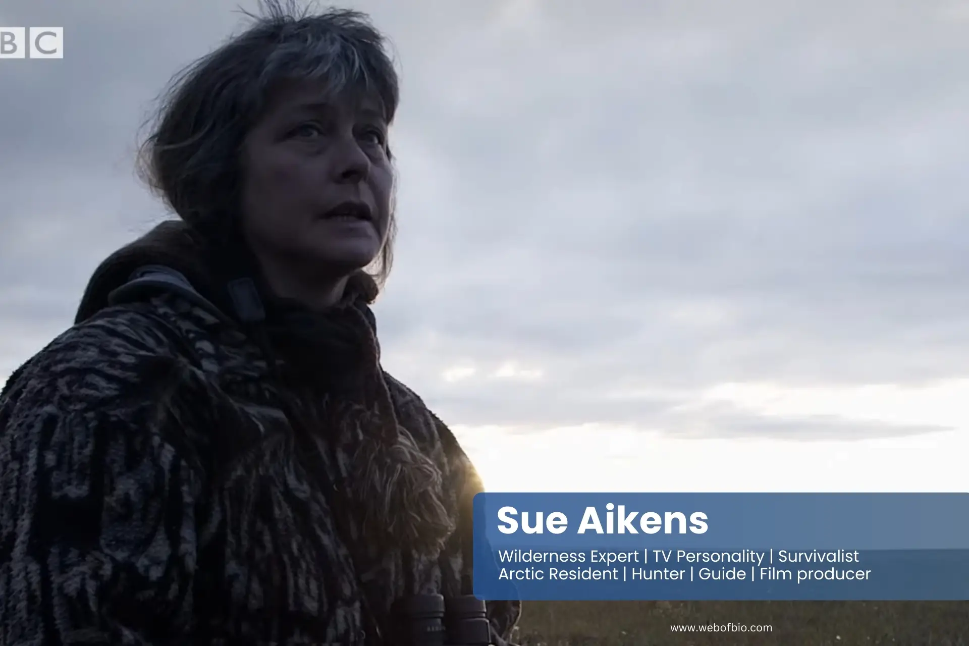 Sue Aikens standing in the middle of a field.
