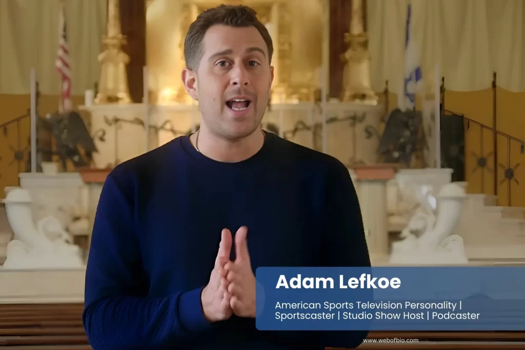 Adam Lefkoe standing and reporting for TV in front of a church.