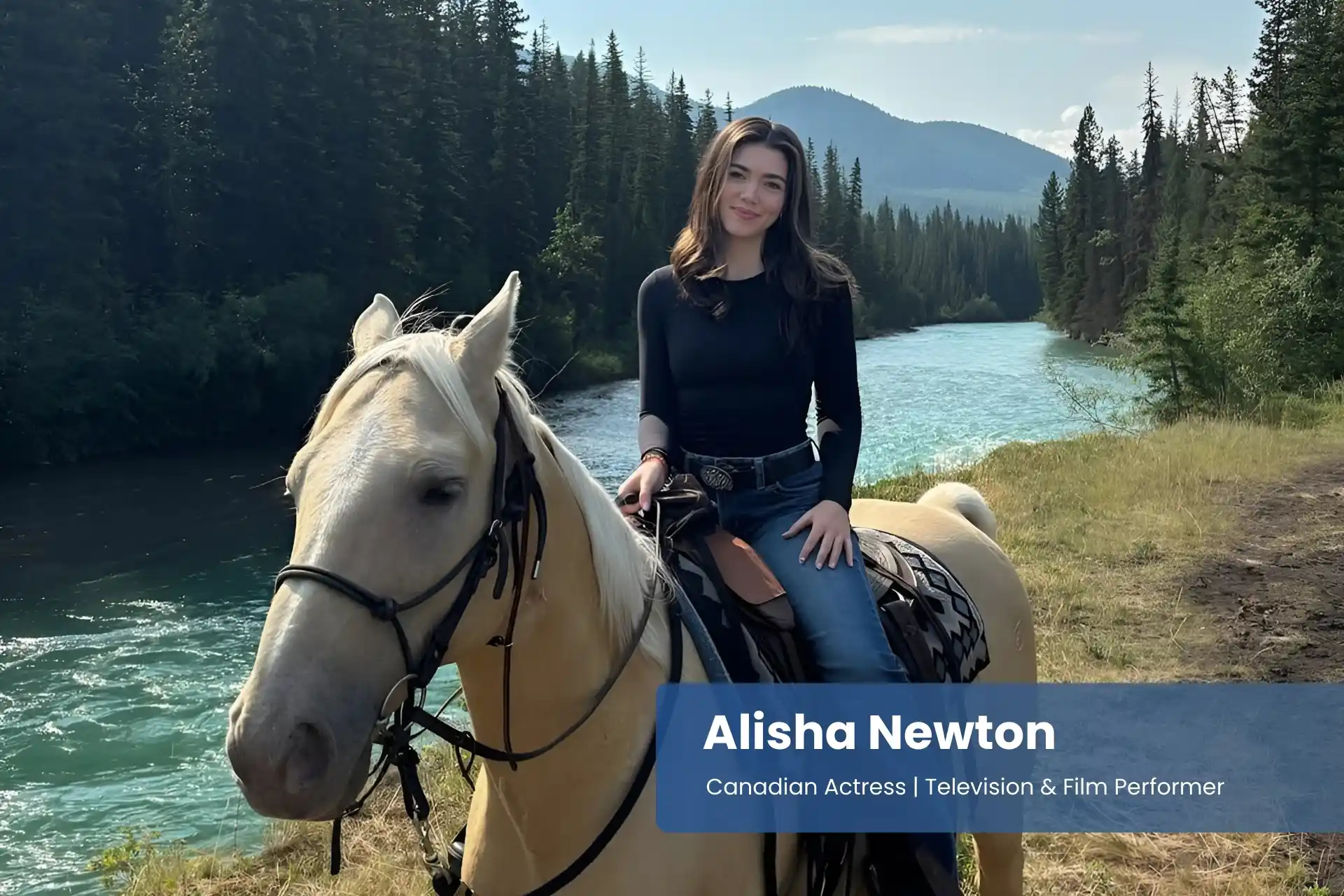 Alisha Newton is riding a horse on the side of a river.