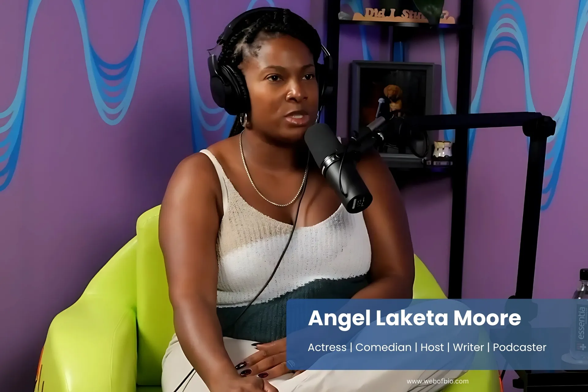 Angel Laketa Moore wearing headphones for podcast.
