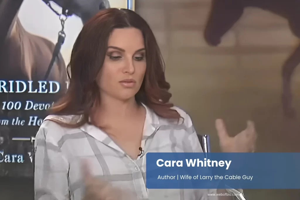 Cara Whitney is speaking confidently on a television show set, engaging with the host and audience.
