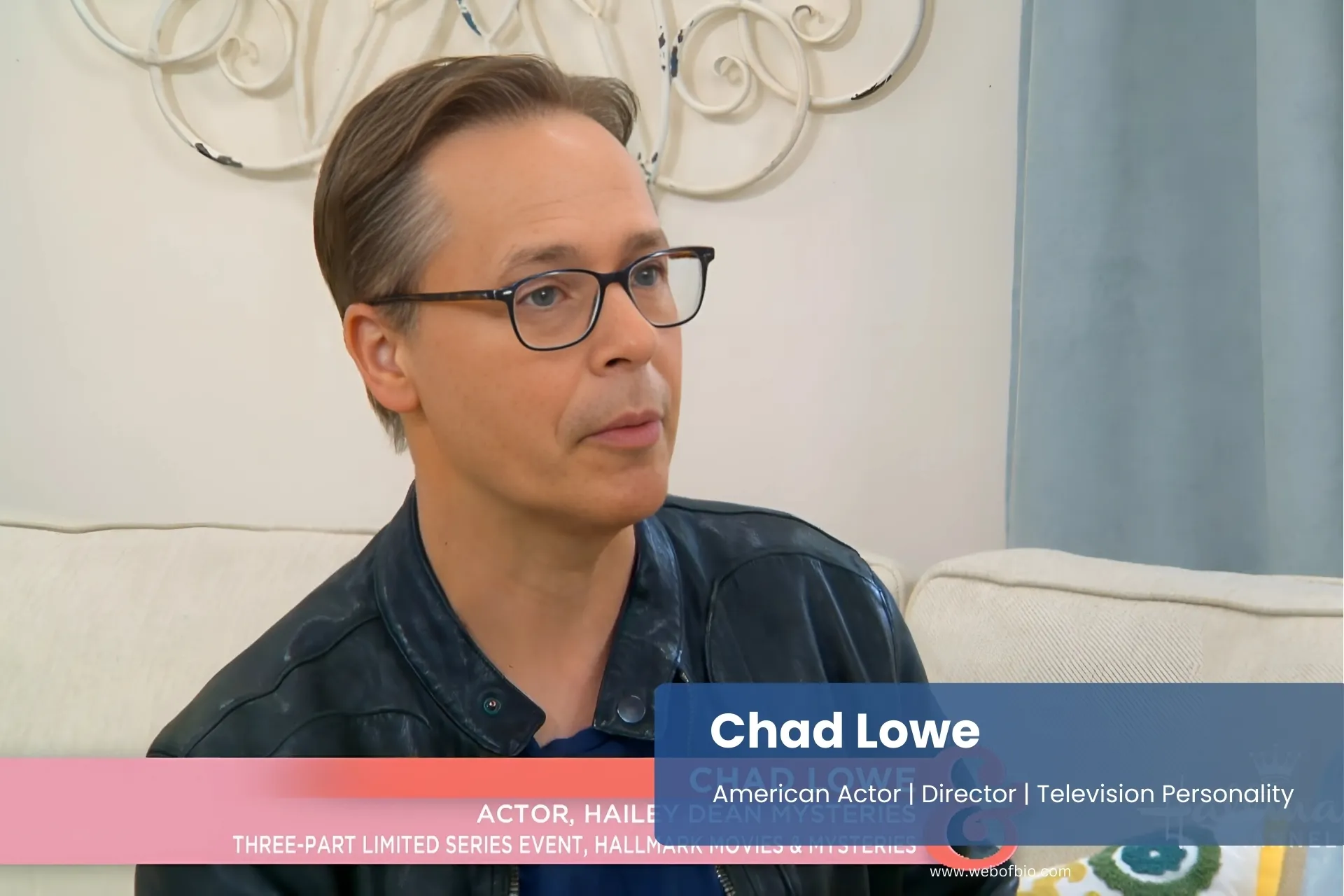 Chad Lowe engaged in conversation while sitting on a comfortable couch.