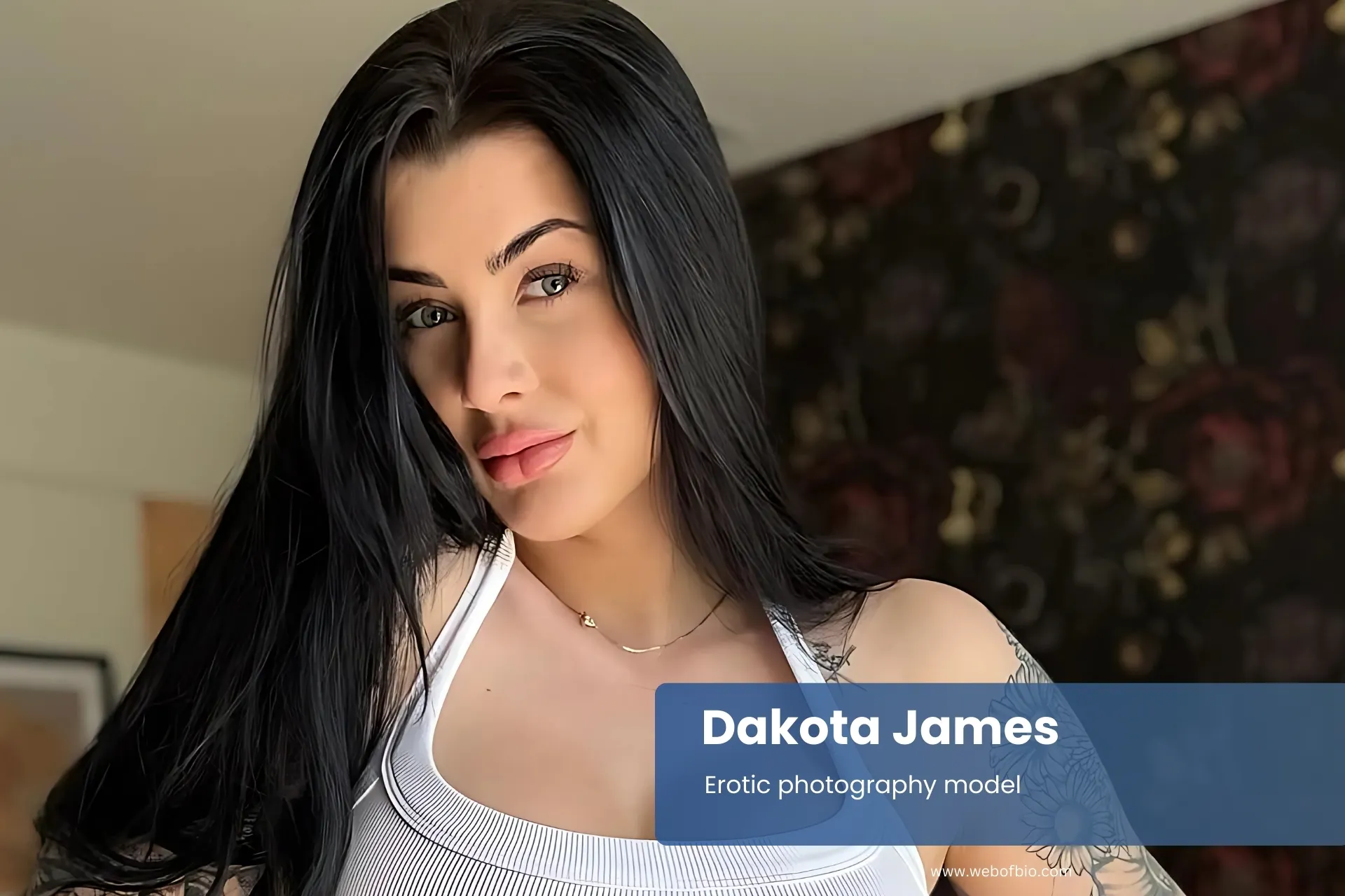 Dakota James with tattoos posing confidently for photo.