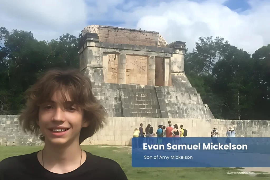 Evan Samuel Mickelson standing in front of an ancient building.