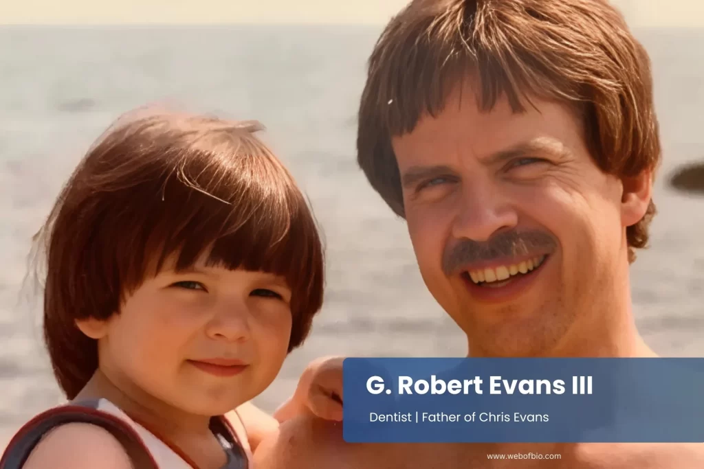 G. Robert Evans III and a child stand side by side, smiling and looking towards the camera in a friendly pose.