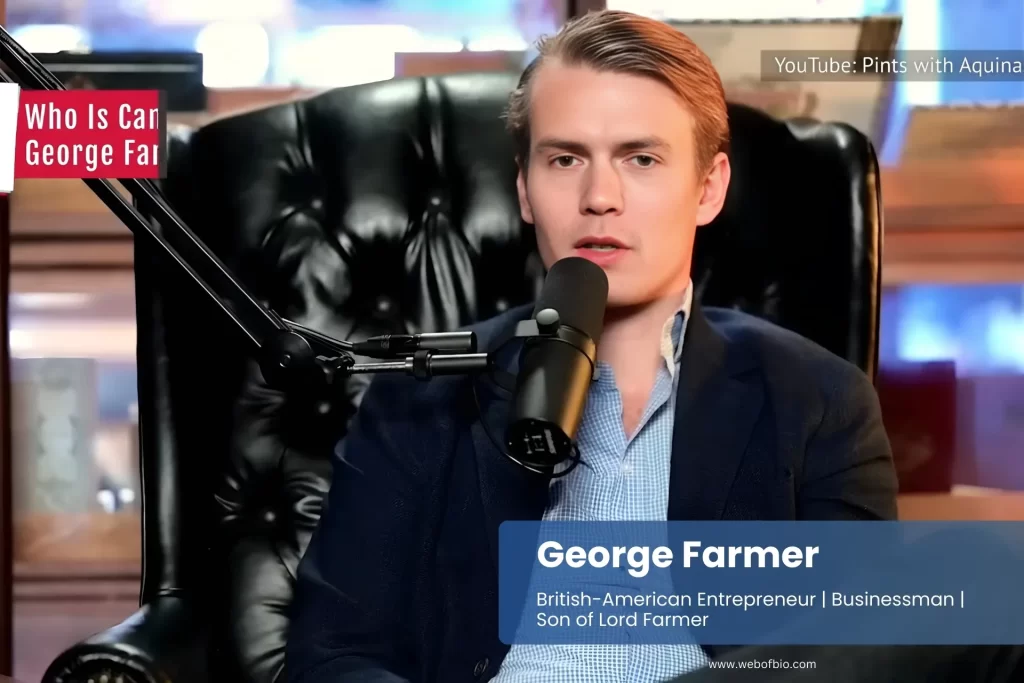 George Farmer sitting in a chair, speaking into a microphone during an interview or presentation.