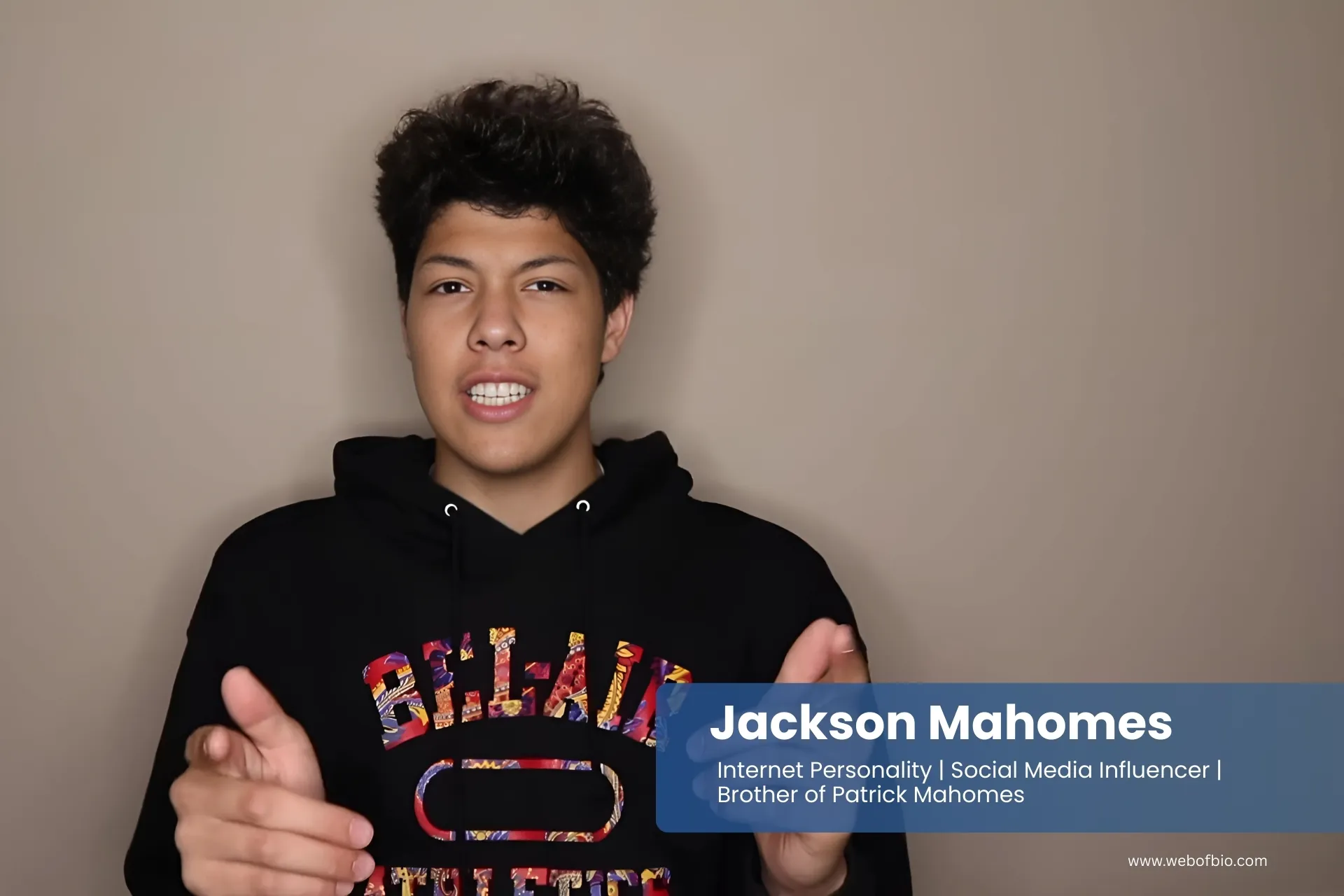 Jackson Mahomes wearing a sweatshirt with the words belain on it.
