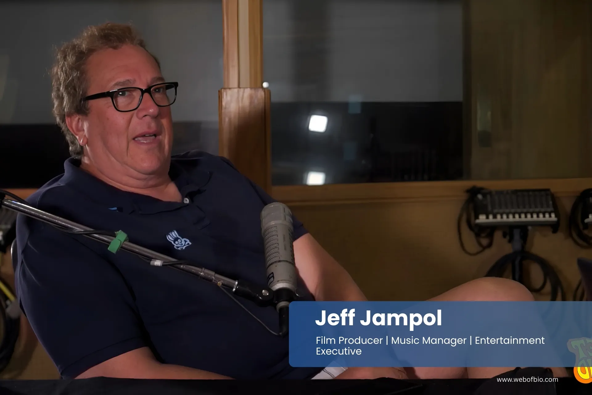 Jeff Jampol is sitting in front of a microphone.