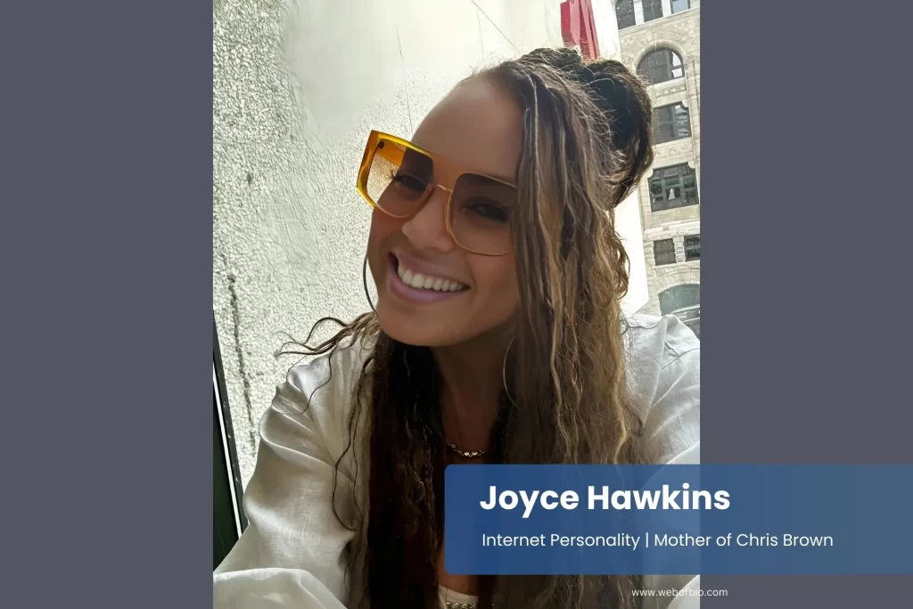 Joyce Hawkins sunglasses smiling.
