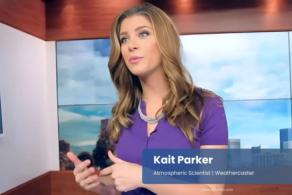 Kait Parker purple shirt speaking microphone news broadcast.