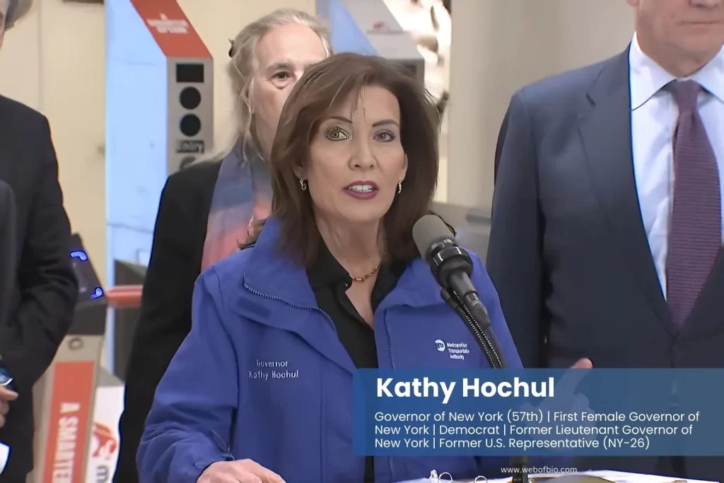 Kathy Hochul blue jacket shirt speaking audience.