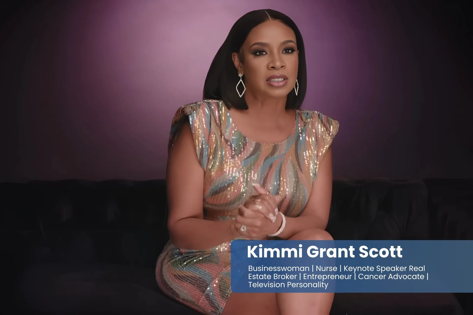 Kimmi Grant Scott in a sequin dress sitting on a couch.