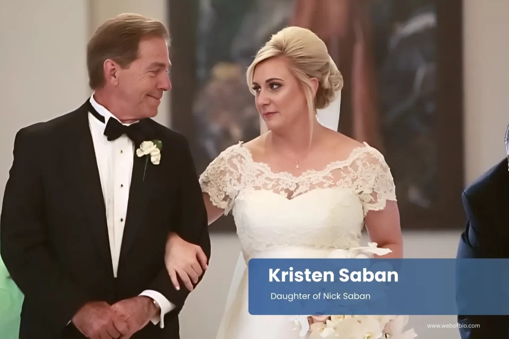 Kristen Saban and Nick Saban walking down the aisle together.