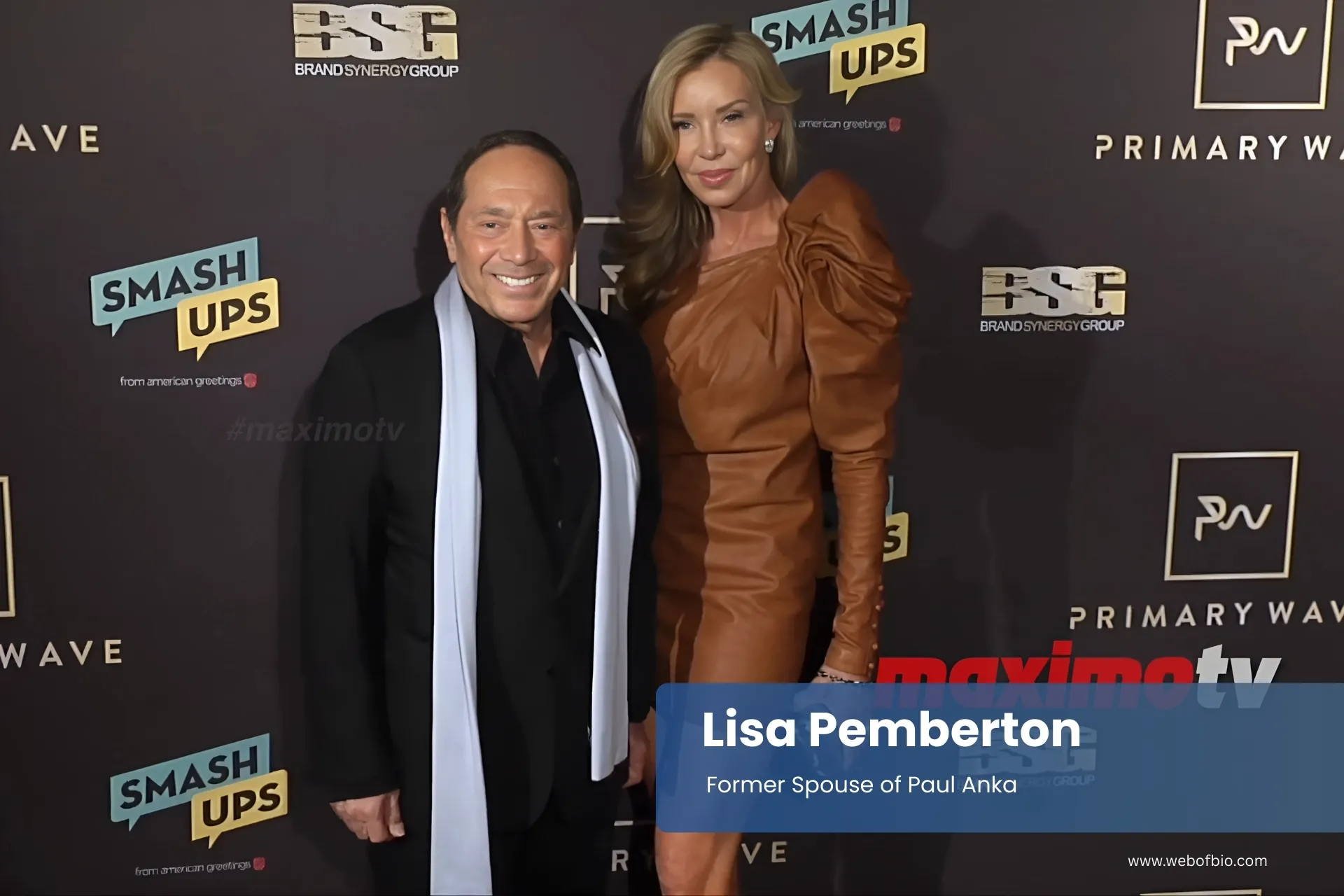 Lisa Pemberton and her former spouse Paul Anka standing next to each other on a red carpet.