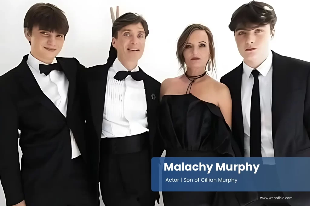 Malachy Murphy and Cillian Murphy in tuxedos posing for a picture.