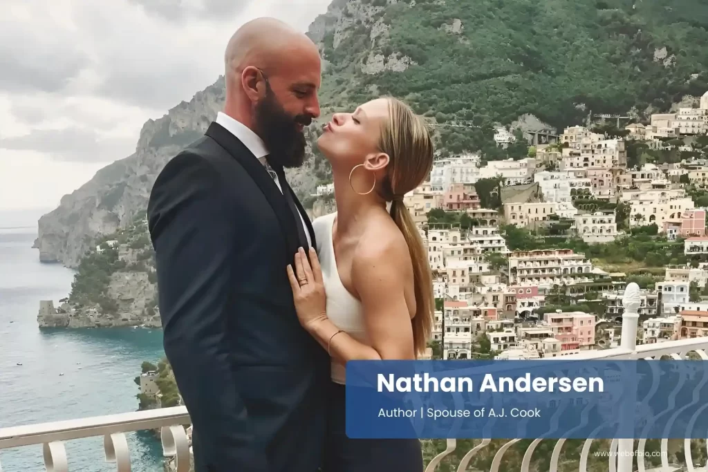 Nathan Andersen and A.J. Cook on a balcony overlooking the sea.