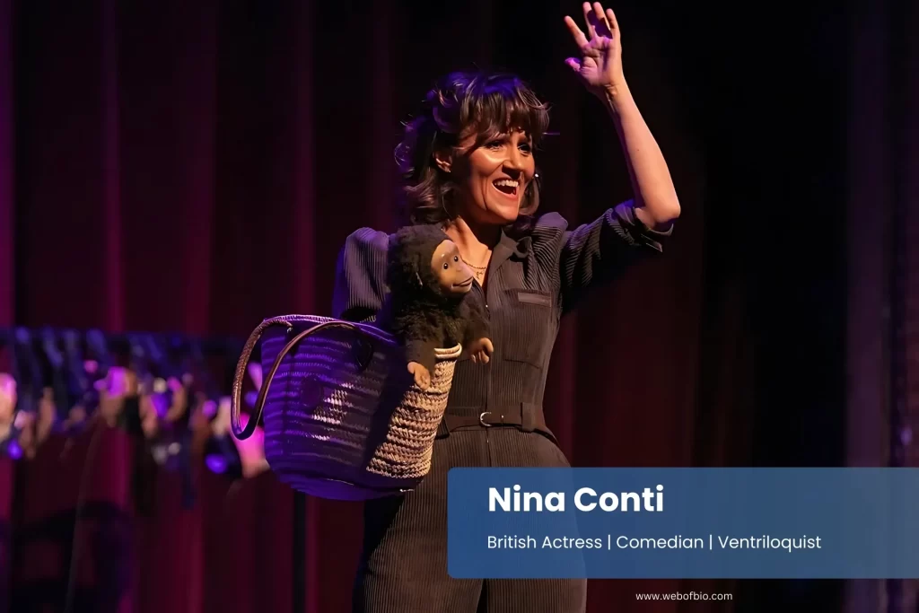 Nina Conti brown jumpsuit stage basket audience.