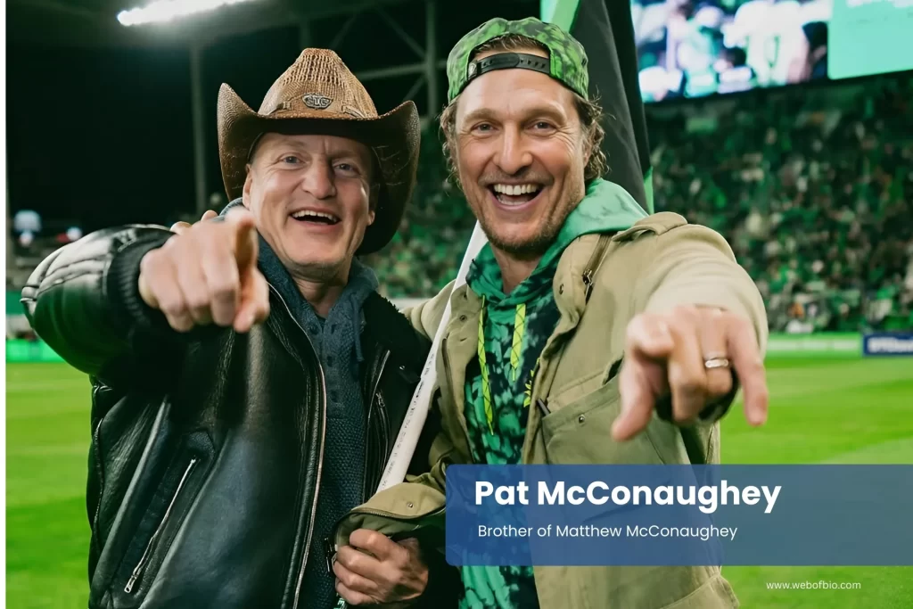 Pat McConaughey and Matthew McConaughey in cowboy hats on a soccer field.