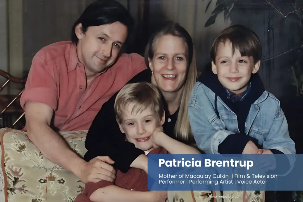 Patricia Brentrup and her family sitting together on a cozy couch, smiling and enjoying each other's company in a warm living room.