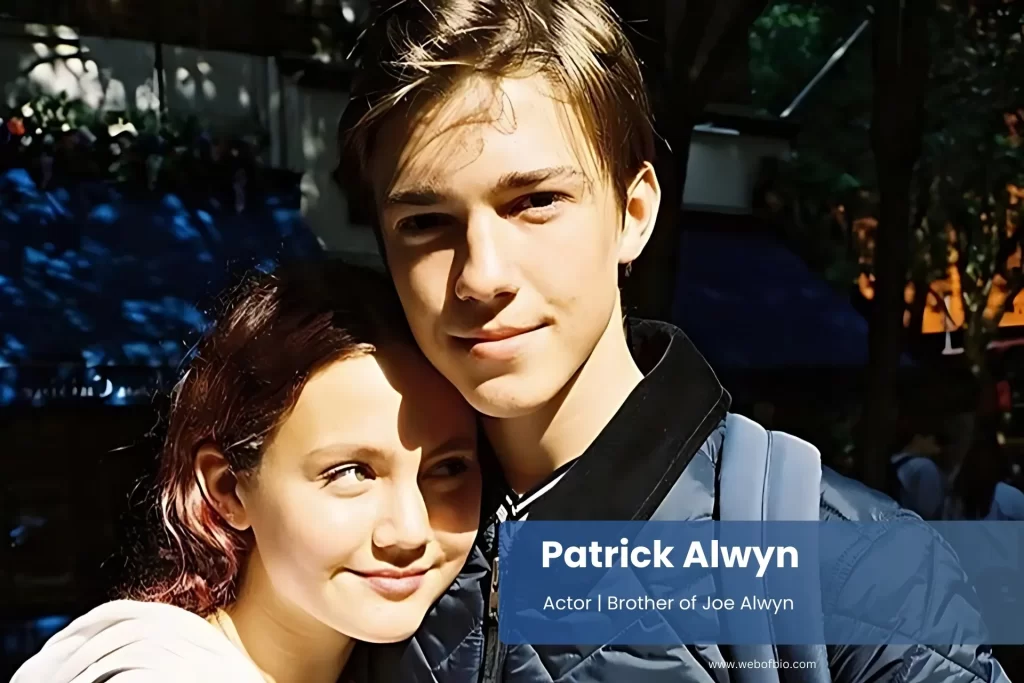 Patrick Alwyn and her sister Joe Alwyn shares a hug in an urban environment.