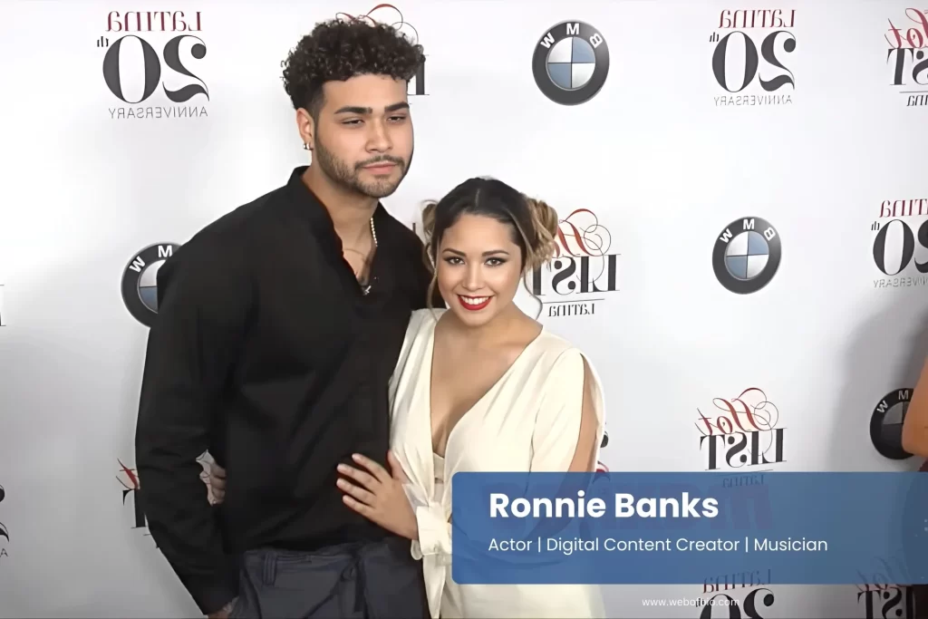 Ronnie Banks and girlfriend posing red carpet elegant event.