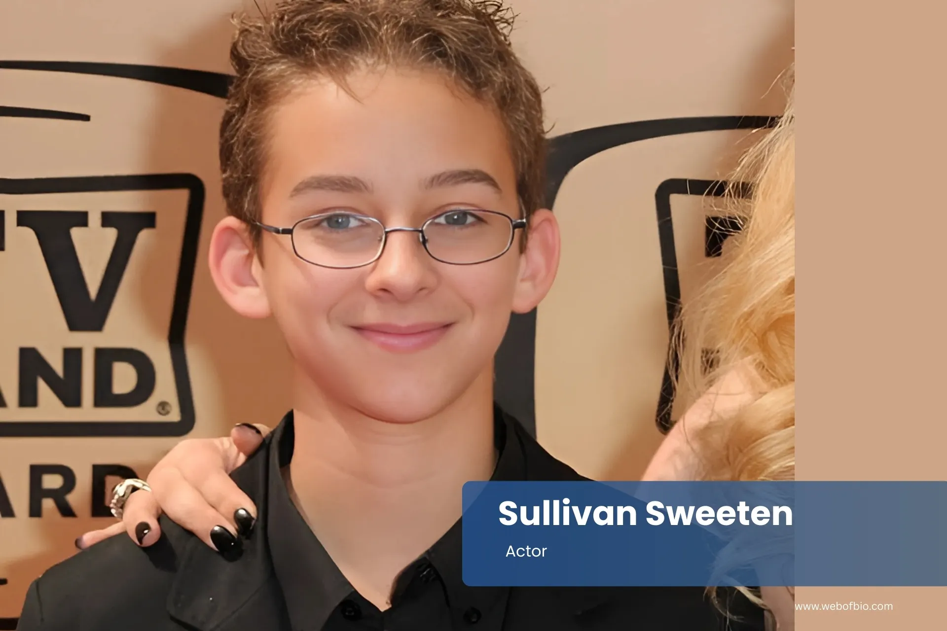 Sullivan Sweeten is standing next to another person.