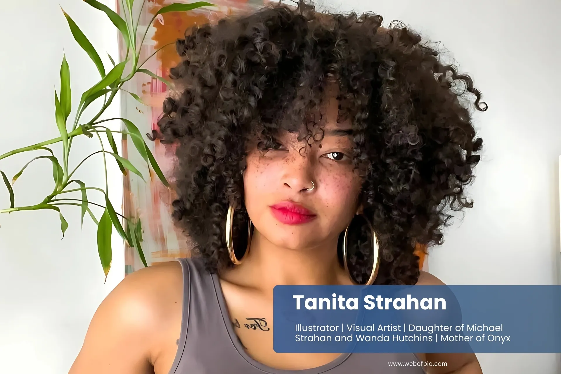 Tanita Strahan is wearing a tank top and jeans.
