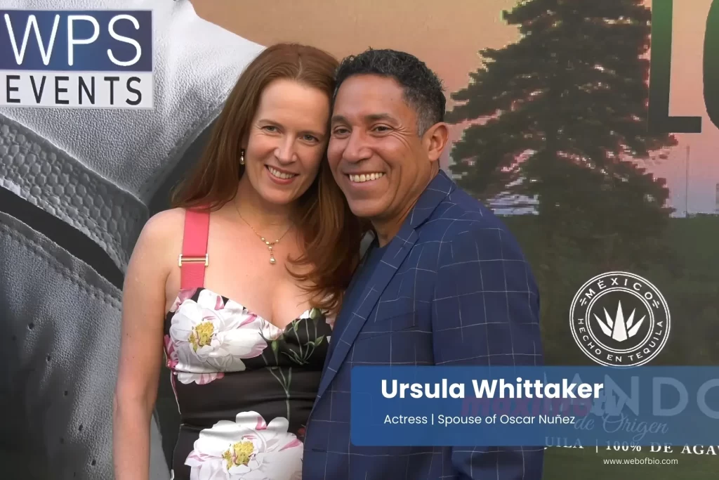 Ursula Whittaker and Oscar Nuñez posing for the camera at an event.