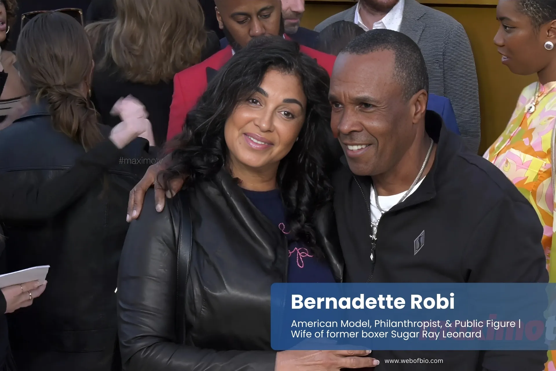 Bernadette Robi and Sugar Ray Leonard posing at event.