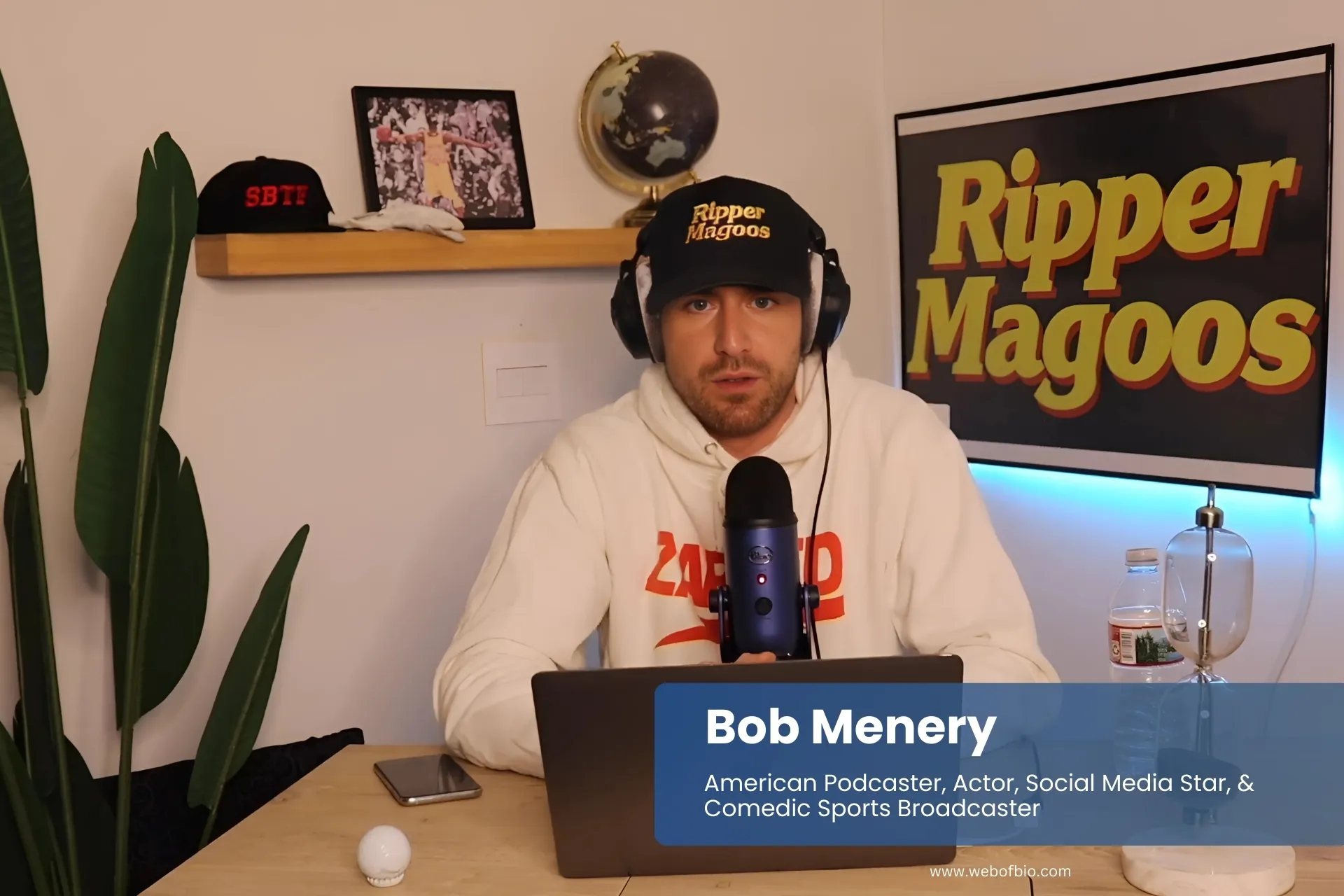 Bob Menery at desk with laptop and microphone.