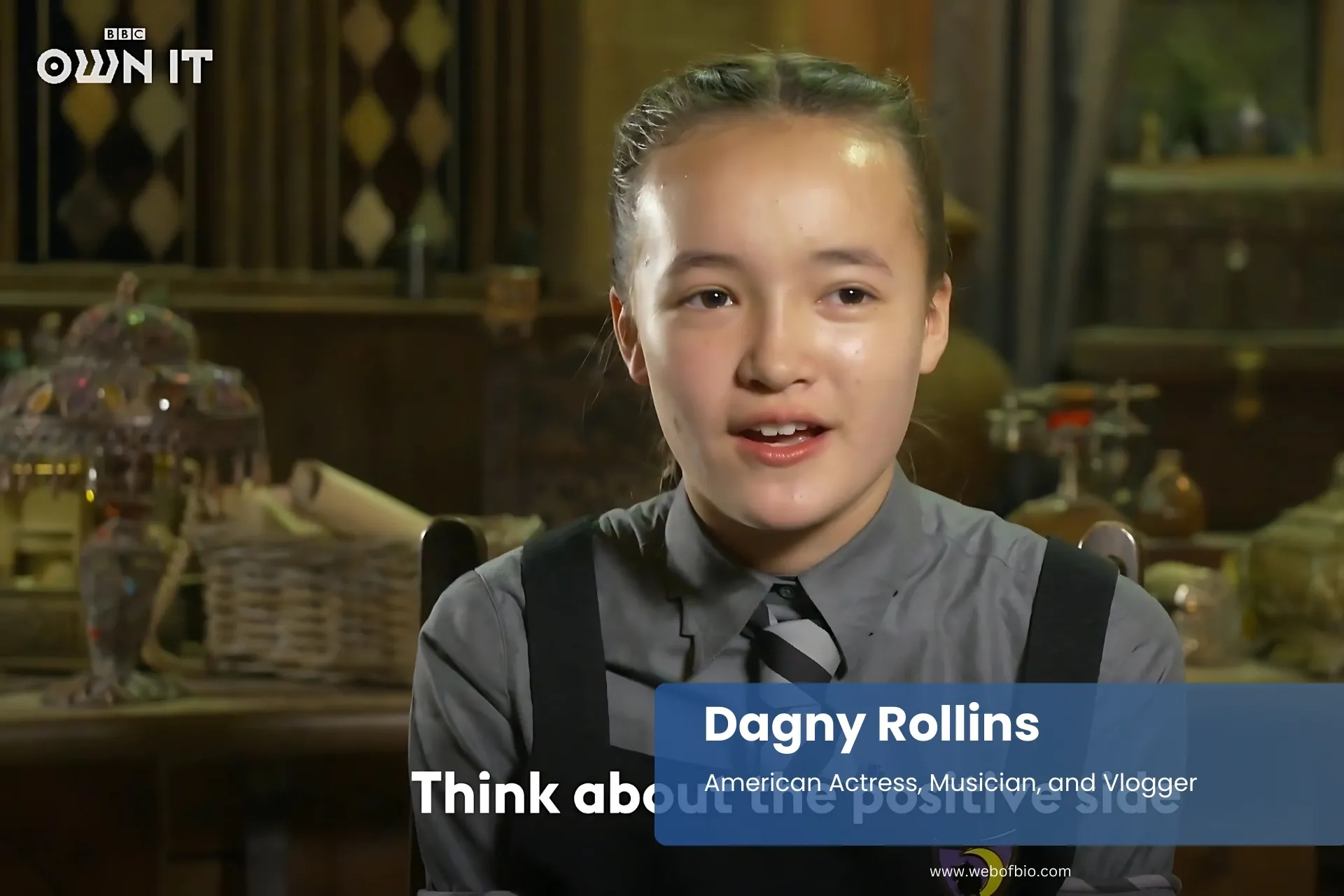 Dagny Rollins tie, sitting at table, looking confident.