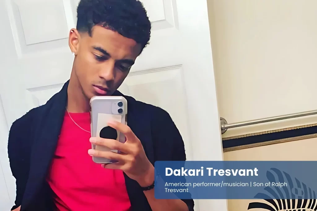 Dakari Tresvant red shirt selfie, smiling.
