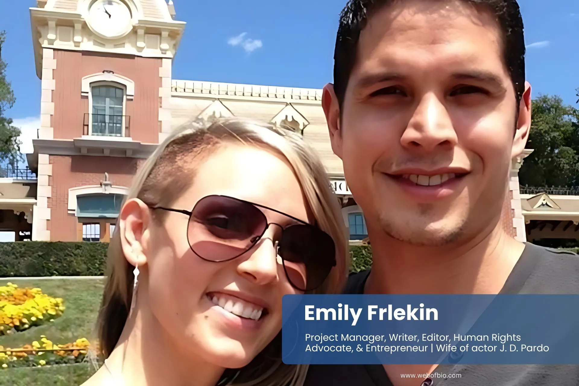 Emily Frlekin and JD Pardo smiling by clock tower.
