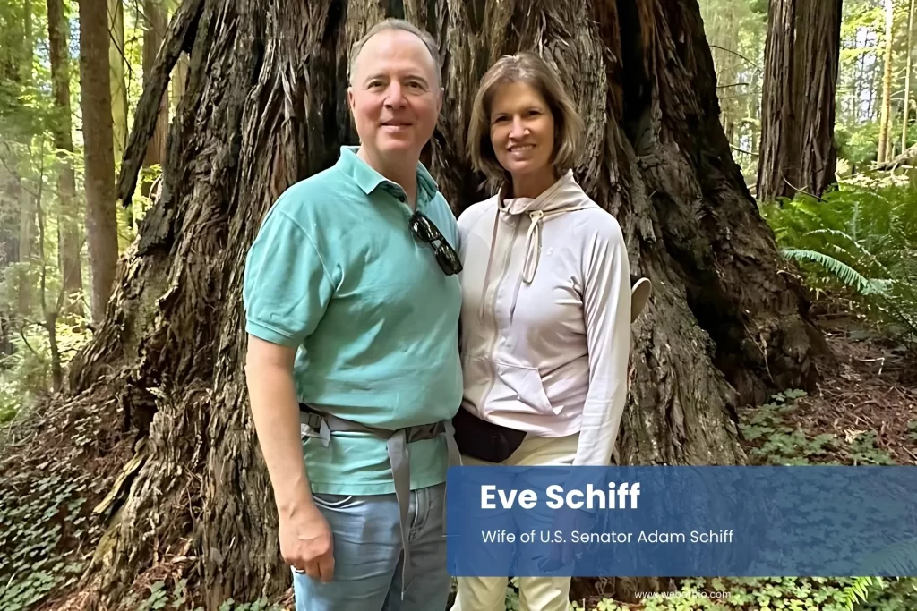 Eve and Adam Schiff beside large tree.