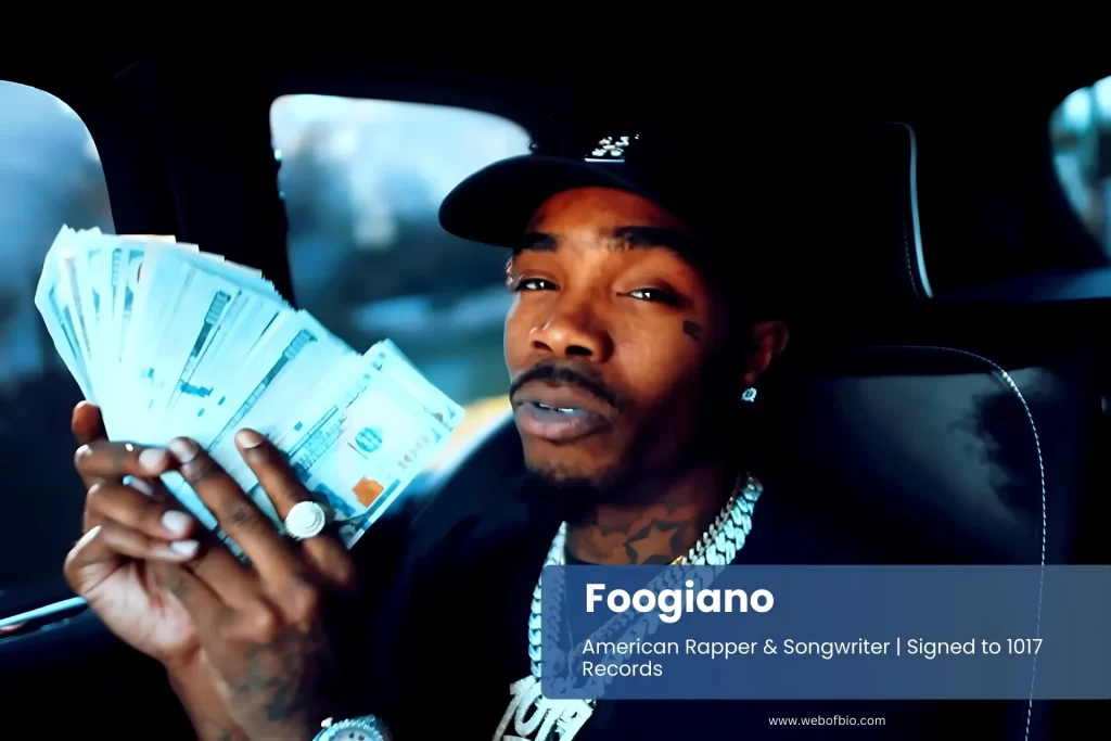 Foogiano in car with money stack.