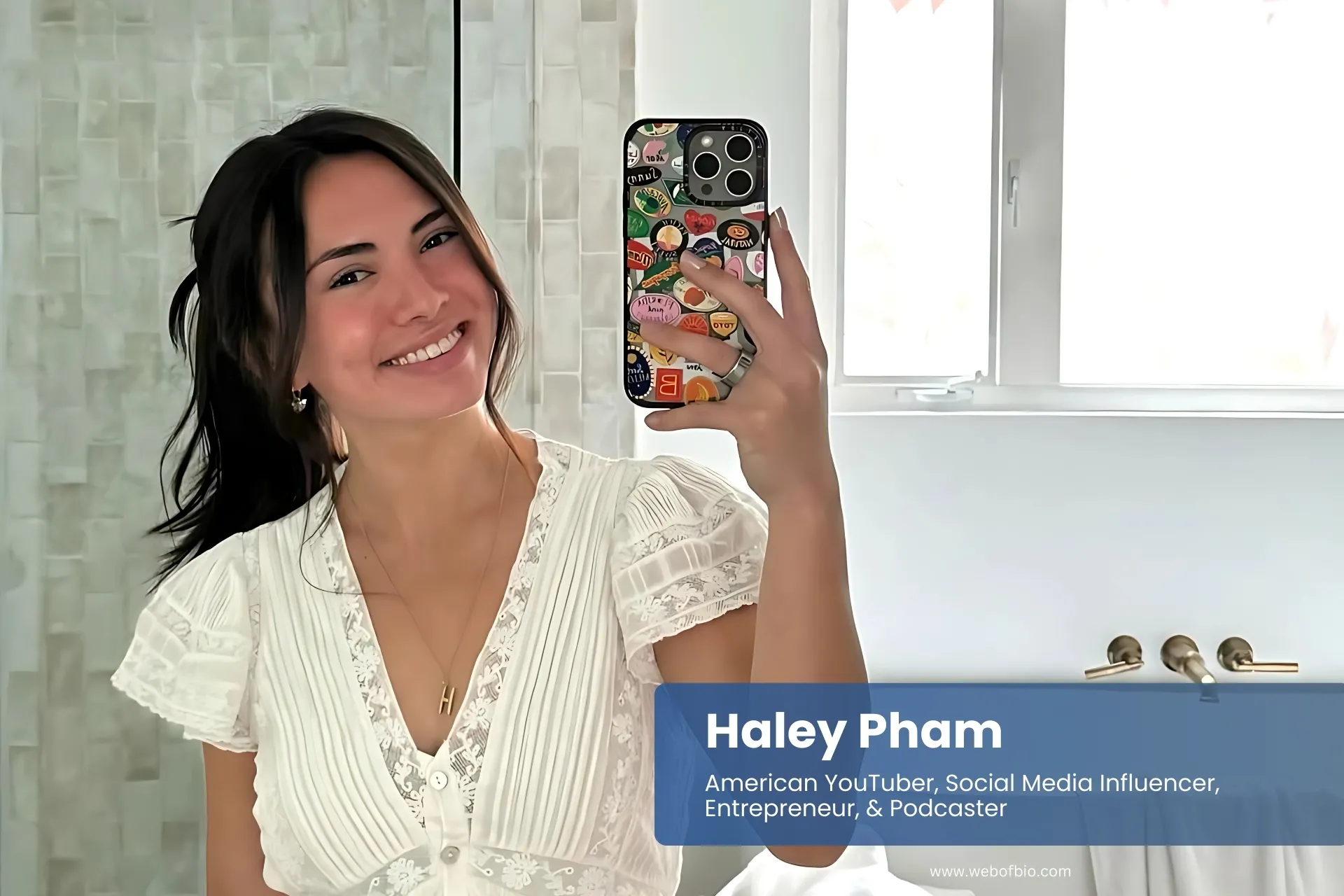 Haley Pham taking selfie in bathroom mirror.