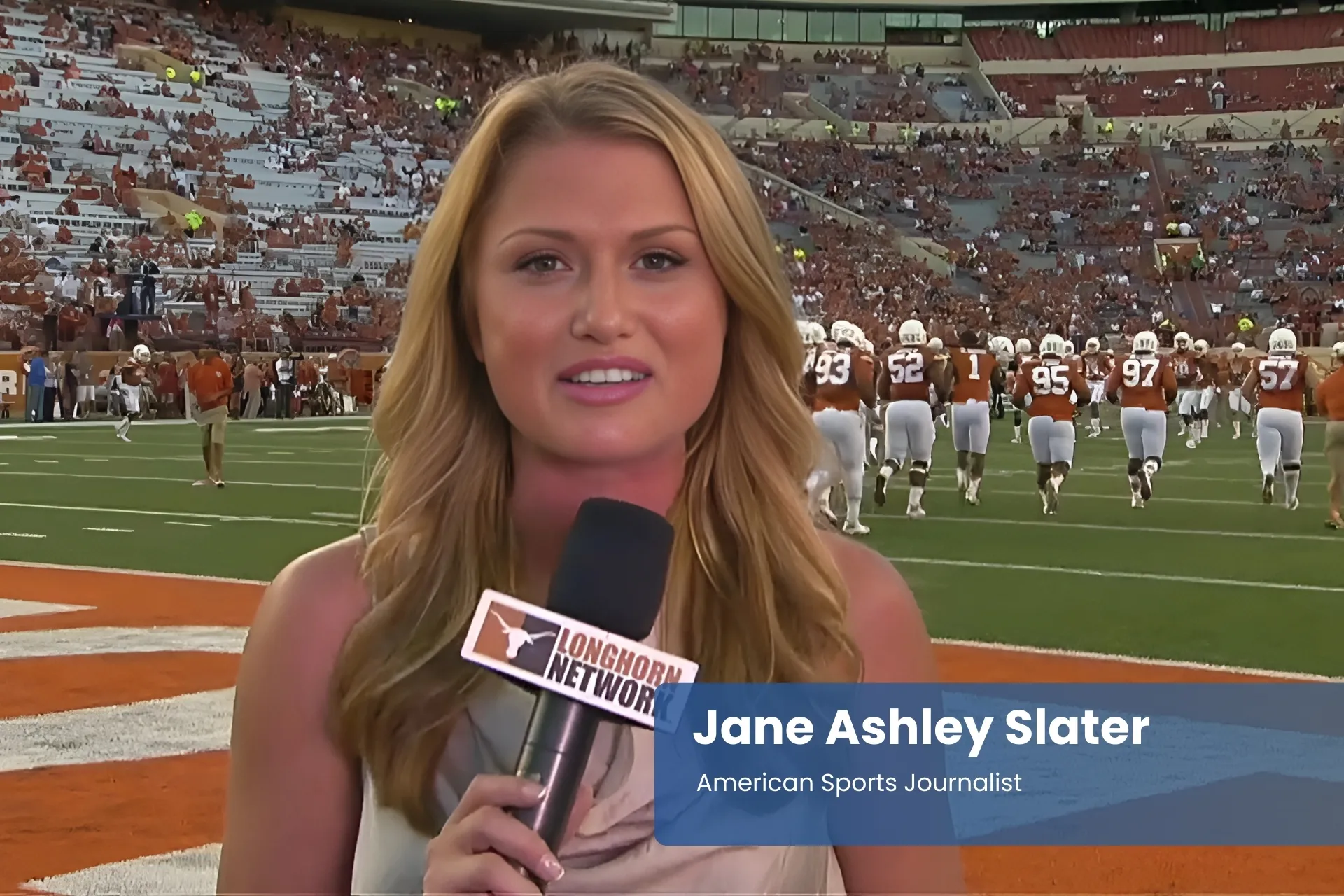 Jane Ashley Slater with microphone at football field.