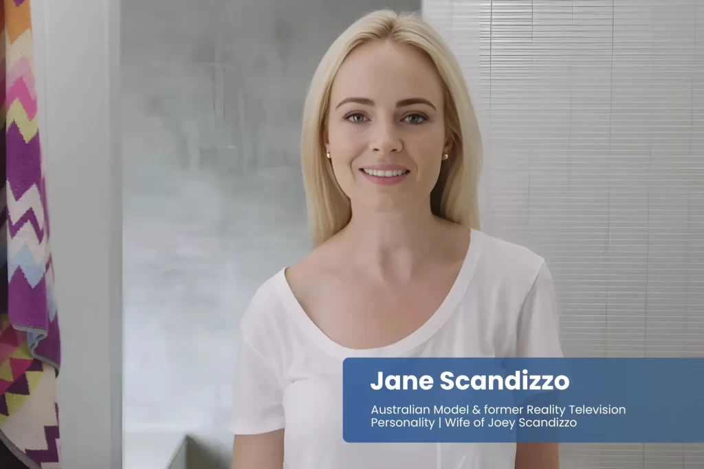 Jane Scandizzo white shirt in front of bathroom.