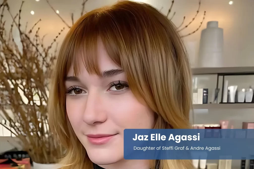 Jaz Elle Agassi with long hair seated in salon.