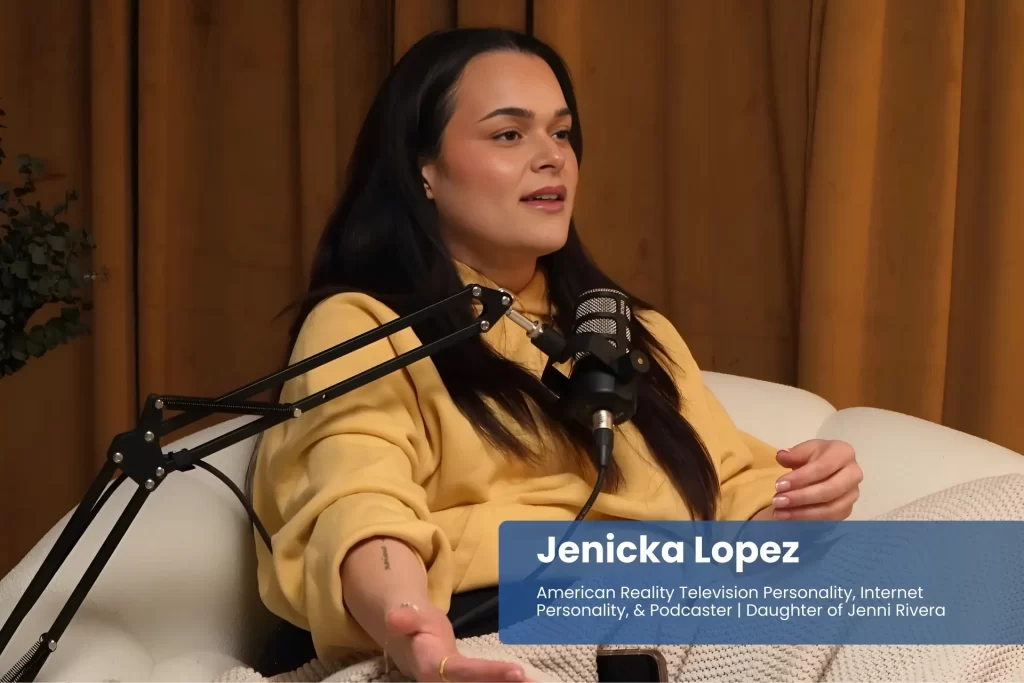 Jenicka Lopez on chair with microphone, ready to speak.