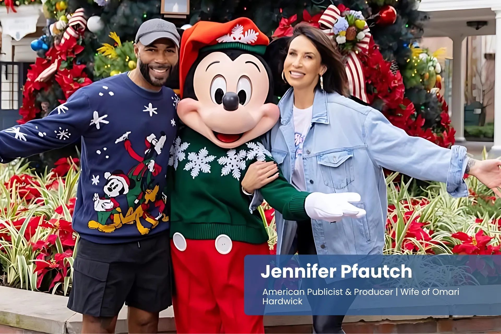 Jennifer Pfautch and Omari Hardwick with Mickey Mouse, Christmas tree.