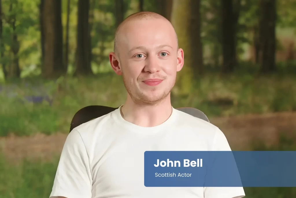 John Bell sitting in chair.