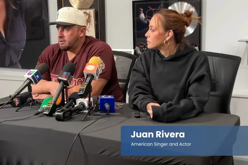 Juan and Brenda Rivera seated with microphones.